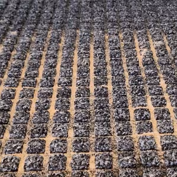 AB-Trapping-Dirt-in-Lower-Level Aqua Barrier Trapping Dirt in Lower Level of Mat